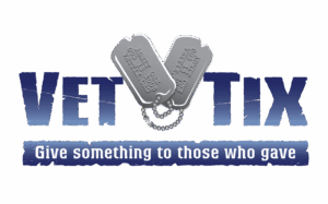 Dog tags in the shape of a heart in the middle of the words 'Vet' and 'Tix' 